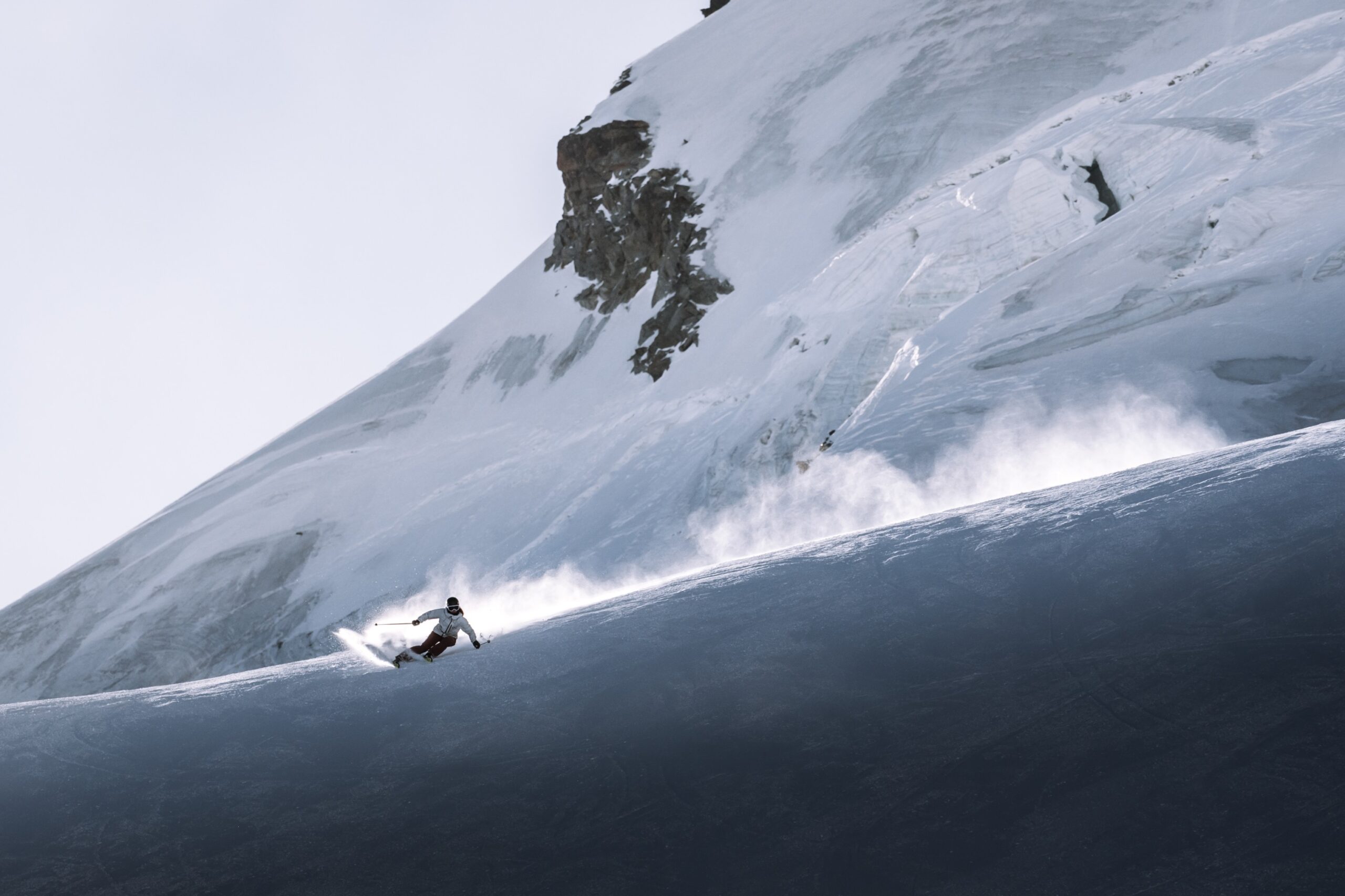 skier carving leaving smoke trail