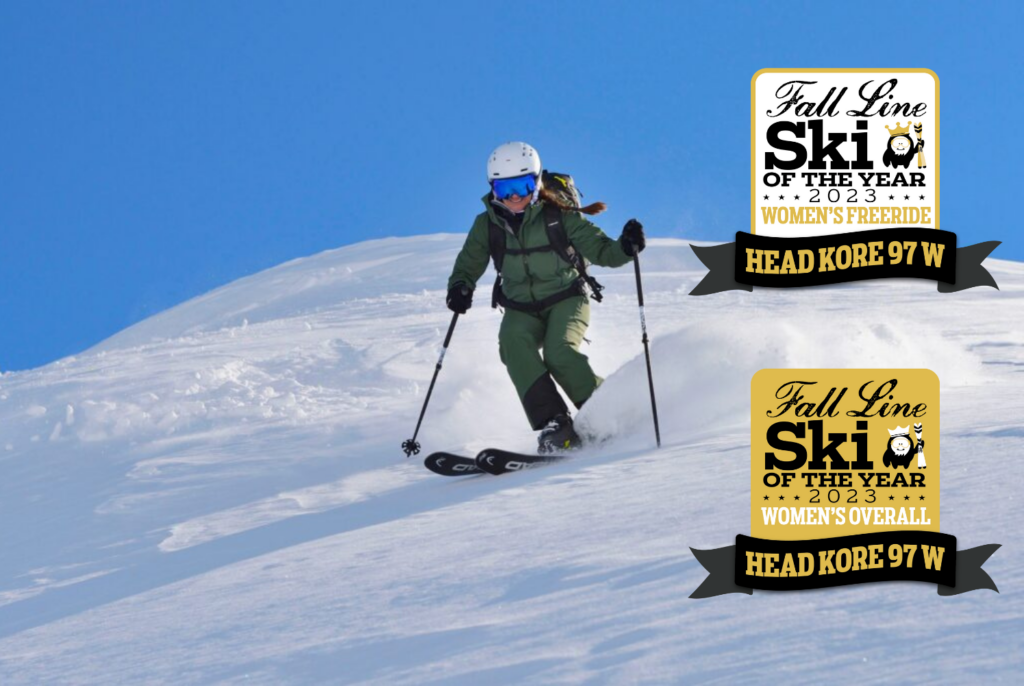female skier on white powdery snow testing head kore skis on a bluebird day. fall line magazine awards on image