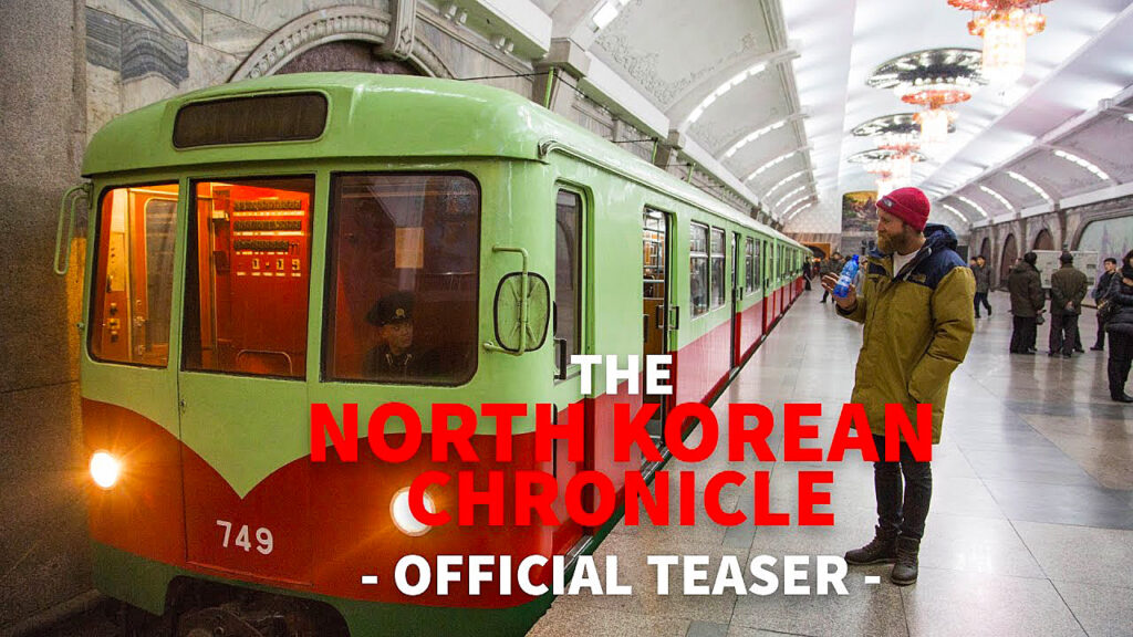 ad trailer for ski chronicles of green train in Korea waiting on platform with skier sam smoothy filming driver from platform