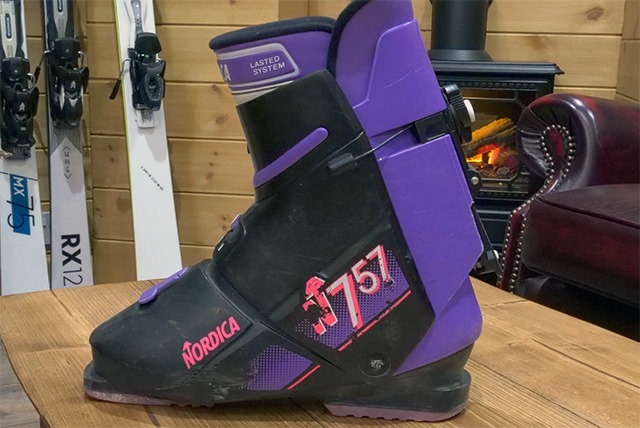 old style back entry ski boot nordica in purple and black