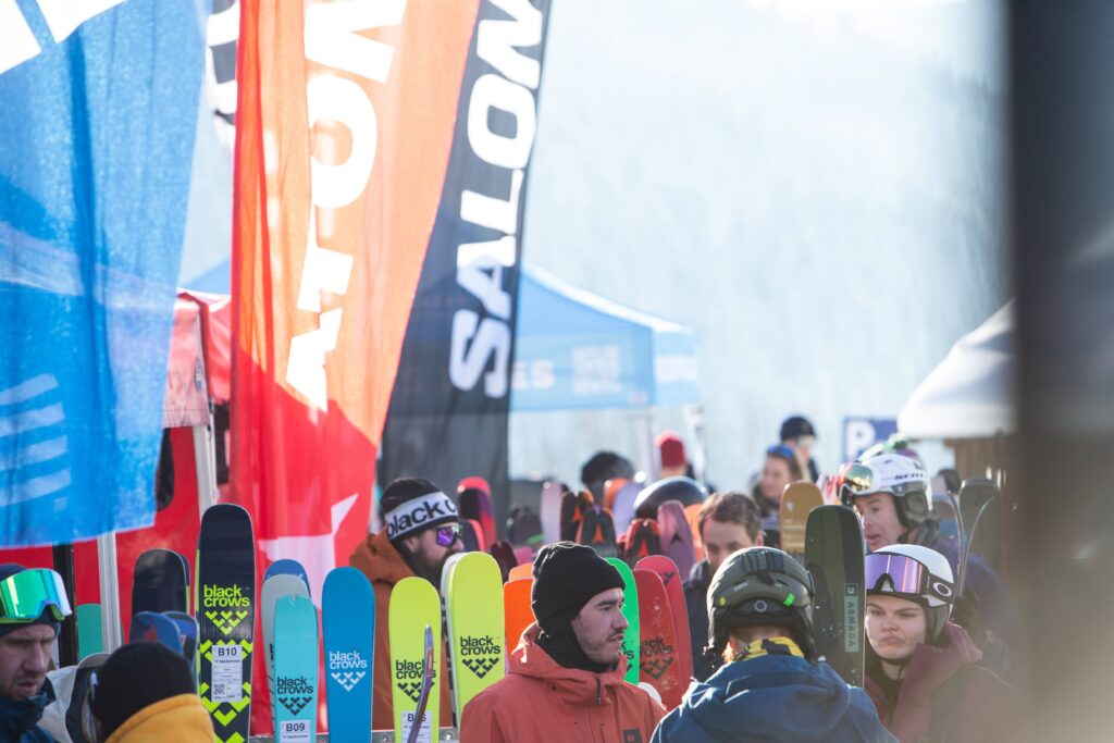 colourful skis, branded banners and skiers faces