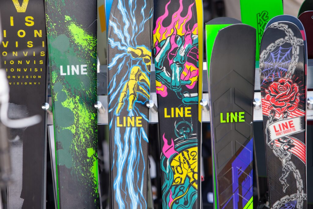 the crazy designs of Line skis on a selection stacked up