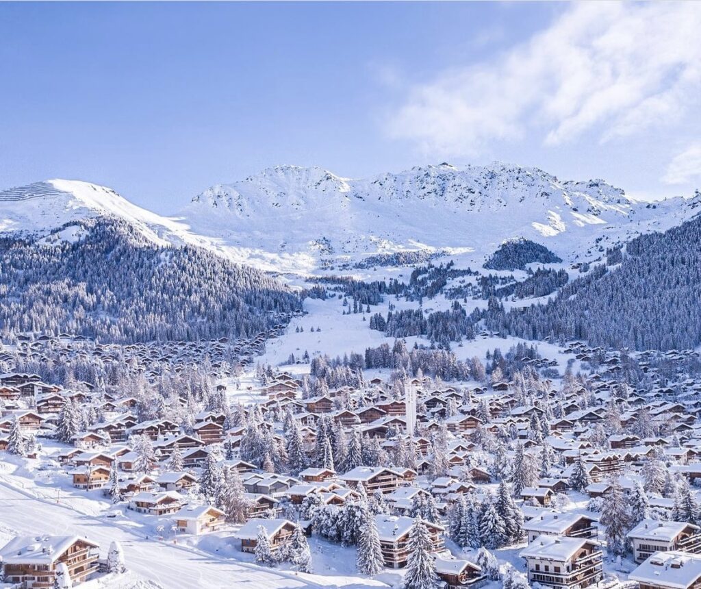 Verbier dusted with snow after much needed snowfall - blue sky and idyllic mountain town image