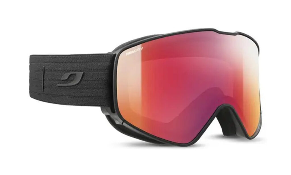 Black Julbo goiggles with pink orange lenses in product photo for Fall Line's Best ski goggles of 2023
