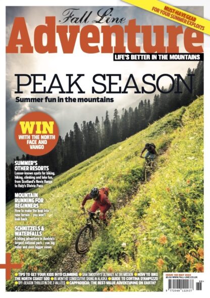 Fall Line summer Adventure issue cover, with cover picture of two mountain bikers on a trail through a wildflower meadow, a forest behind