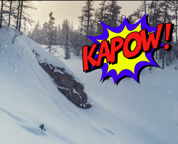 skier powder and a comic book text overlay reading KAPOW!