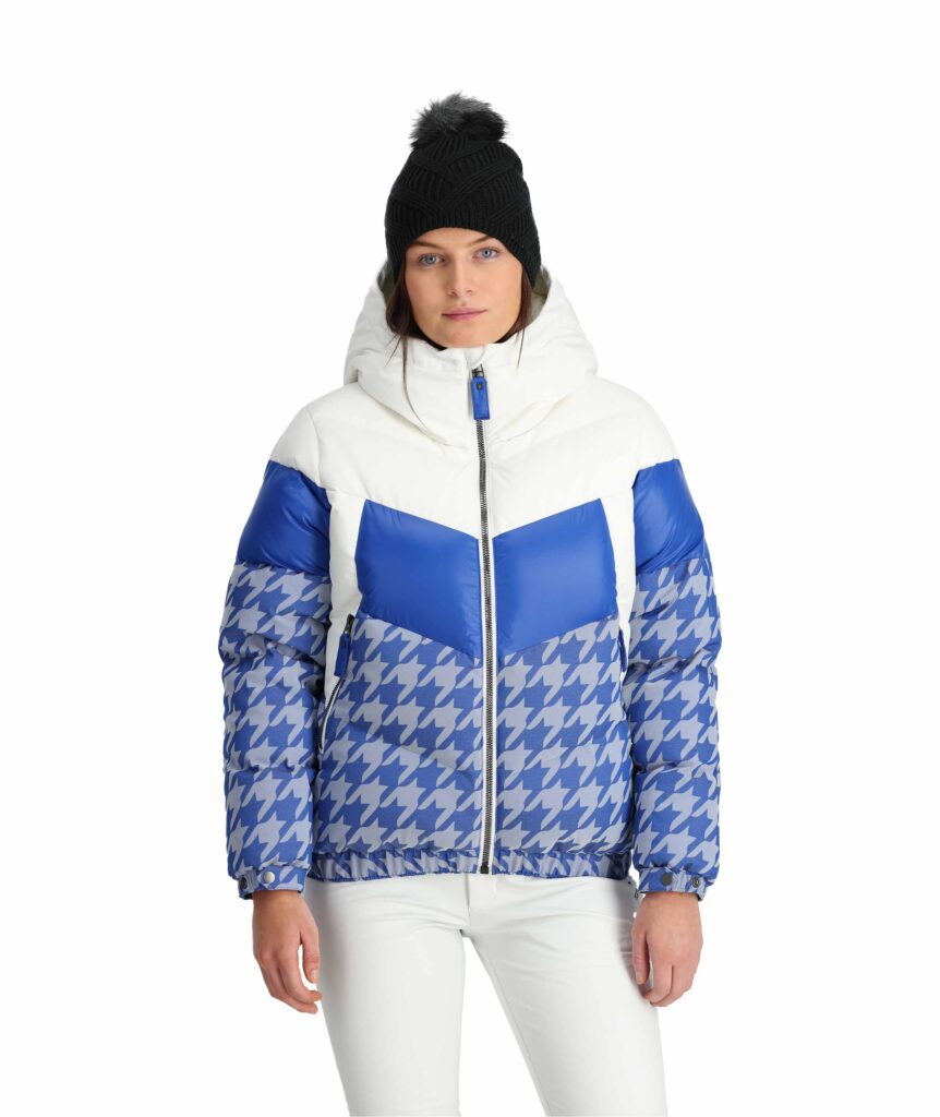 a woman in a product photo wearing a blue and white puffer ski jacket