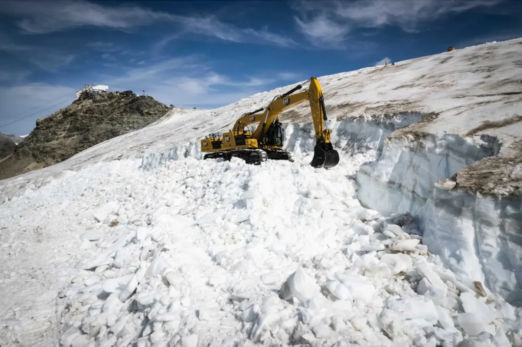 snowcat digging into glacier