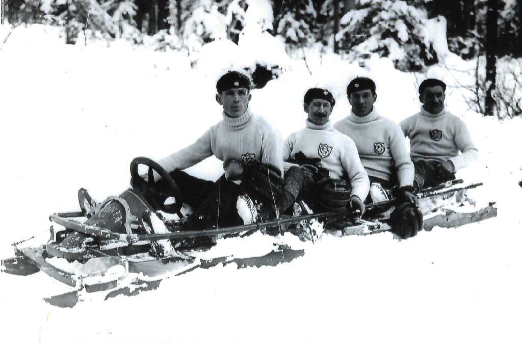 four men in a bobsleigh in a black and white image from 1924 Winter Games