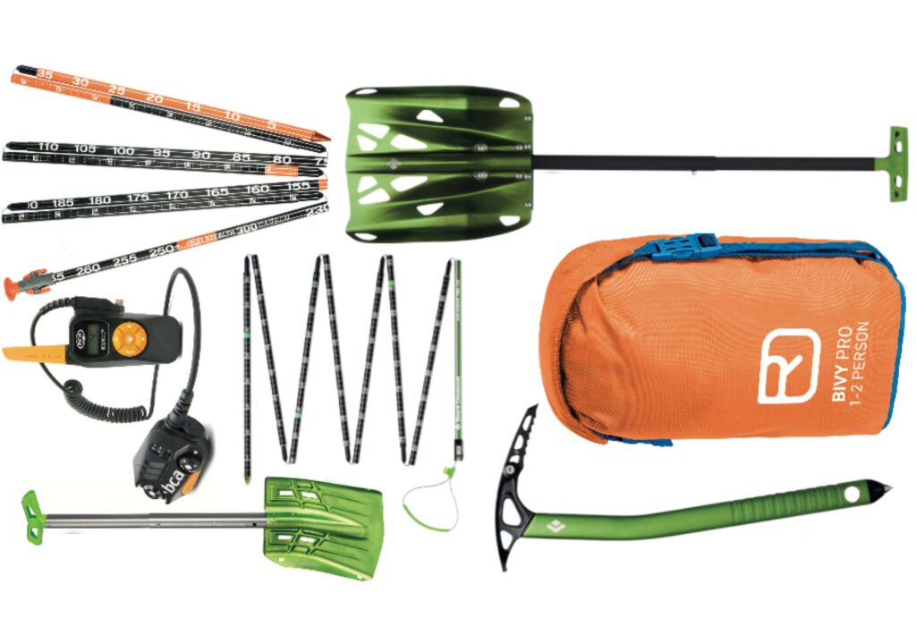 a selection of backcountry ski gear including probe, shovel, radio